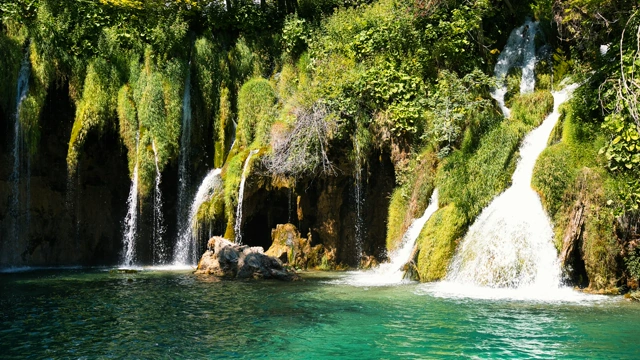 Plitvice Lakes waterfalls and a turquoise forest pool, the national park covered in our guide to visiting Plitvice with a dog